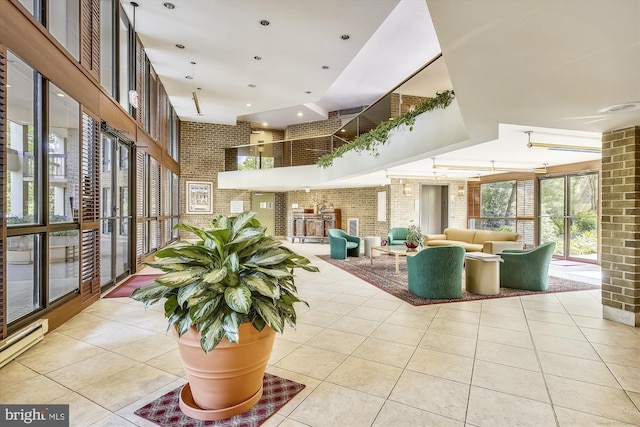 801 N Howard St Unit 305, Alexandria, VA 22304 - community lobby featuring brick wall and a high ceiling