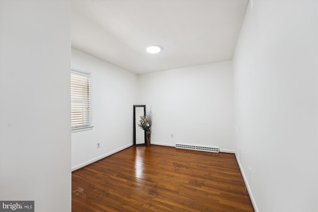 6775 Amherst Rd, Bryans Road, MD 20616 - unfurnished room with a baseboard heating unit, hardwood / wood-style flooring, and baseboards