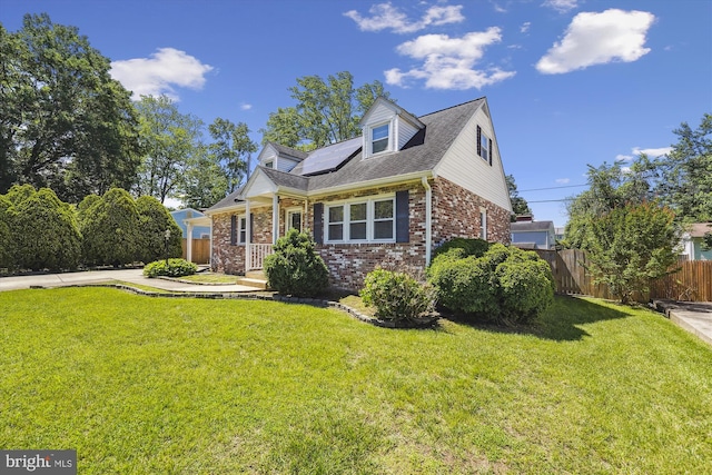 6775 Amherst Rd, Bryans Road, MD 20616 - cape cod house featuring brick siding, solar panels, and roof with shingles