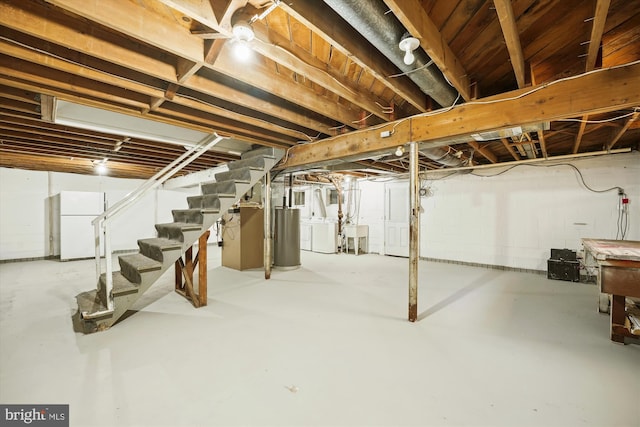 6775 Amherst Rd, Bryans Road, MD 20616 - unfinished basement with freestanding refrigerator, stairs, water heater, and a sink