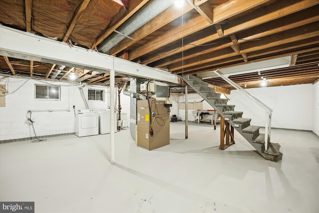 6775 Amherst Rd, Bryans Road, MD 20616 - unfinished below grade area featuring washer and dryer, stairs, heating unit, and drainage system