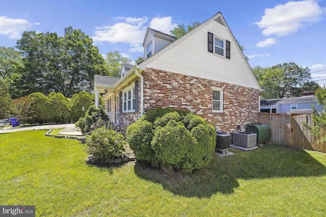 6775 Amherst Rd, Bryans Road, MD 20616 - view of side of property featuring brick siding, central AC, and oil tank