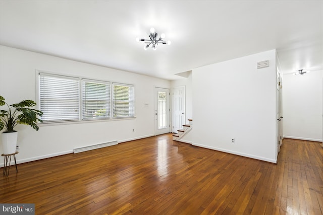 6775 Amherst Rd, Bryans Road, MD 20616 - unfurnished living room with a baseboard radiator, stairway, hardwood / wood-style flooring, a chandelier, and baseboards