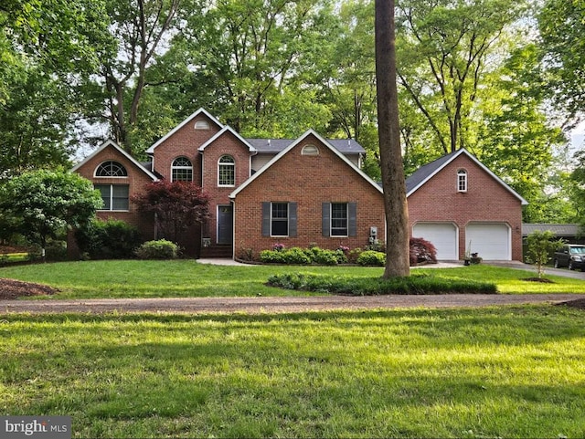 16245 River Bend Ct, Williamsport, MD 21795 - traditional-style house with brick siding, a front yard, and a detached garage
