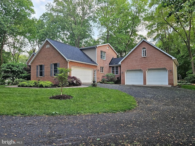 16245 River Bend Ct, Williamsport, MD 21795 - traditional home featuring brick siding, a front yard, an attached garage, and asphalt driveway