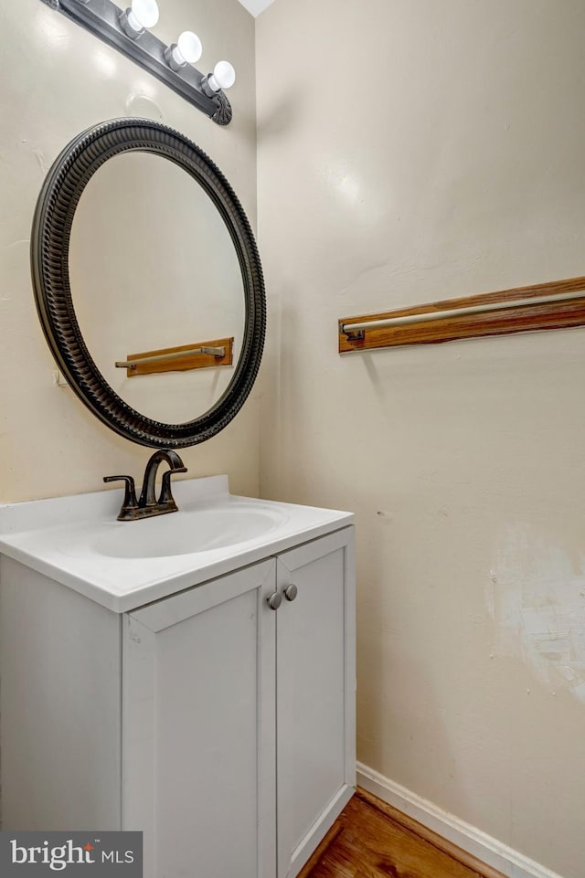 8760 Stoneridge Dr, Manassas, VA 20111 - bathroom featuring vanity, wood finished floors, and baseboards