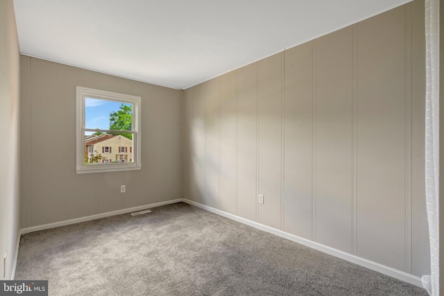 8760 Stoneridge Dr, Manassas, VA 20111 - unfurnished room with carpet floors, a decorative wall, and baseboards
