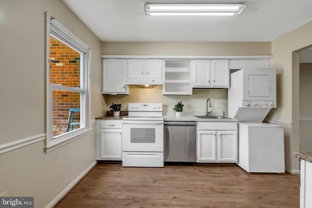 8760 Stoneridge Dr, Manassas, VA 20111 - kitchen featuring white electric range, stainless steel dishwasher, stacked washer / dryer, and white cabinetry