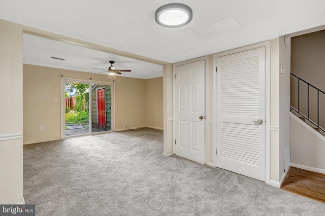 8760 Stoneridge Dr, Manassas, VA 20111 - unfurnished living room featuring ceiling fan, carpet flooring, and baseboards