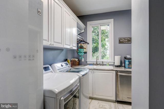 419 Coffee Goss Rd, Marietta, PA 17547 - washroom with washer and clothes dryer, light marble finish flooring, and cabinet space