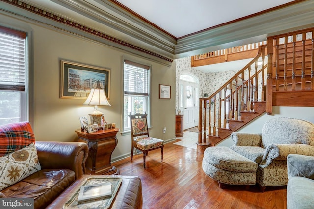 419 Coffee Goss Rd, Marietta, PA 17547 - living area featuring stairs, wallpapered walls, ornamental molding, baseboards, and wood finished floors