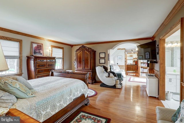 419 Coffee Goss Rd, Marietta, PA 17547 - bedroom featuring arched walkways, light wood-style flooring, and crown molding