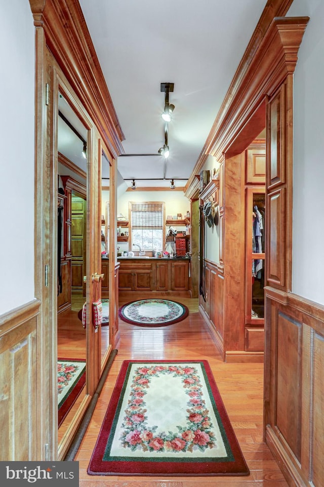 419 Coffee Goss Rd, Marietta, PA 17547 - corridor featuring light wood finished floors, crown molding, track lighting, and french doors