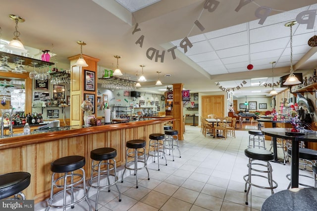 419 Coffee Goss Rd, Marietta, PA 17547 - indoor wet bar with tile patterned flooring, a drop ceiling, and decorative light fixtures