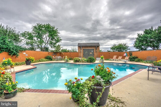 419 Coffee Goss Rd, Marietta, PA 17547 - view of swimming pool featuring a fenced backyard, a patio area, and an outbuilding
