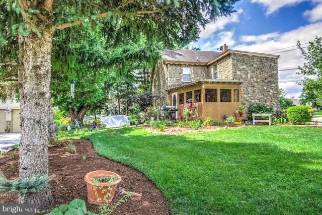 419 Coffee Goss Rd, Marietta, PA 17547 - rear view of house with stone siding, a yard, and a chimney
