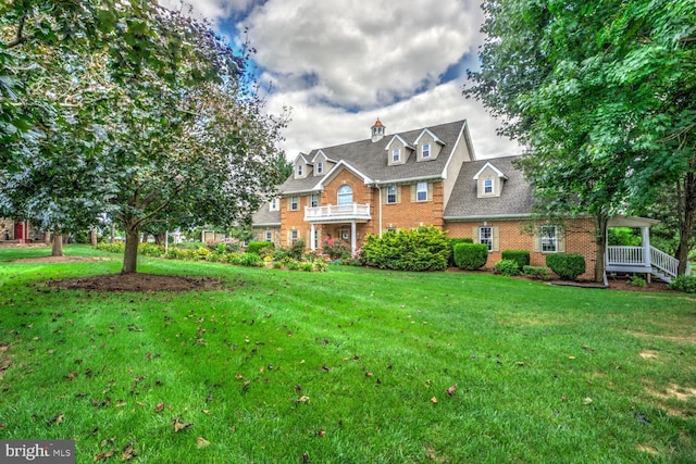 419 Coffee Goss Rd, Marietta, PA 17547 - georgian-style home featuring brick siding and a front lawn