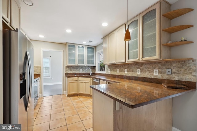 810 Sugarland Run Dr, Sterling, VA 20164 - kitchen with appliances with stainless steel finishes, a peninsula, tasteful backsplash, light tile patterned flooring, and dark countertops