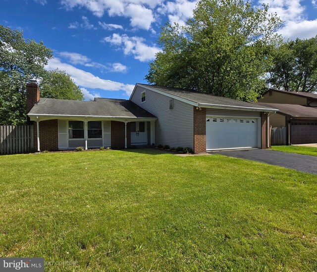 810 Sugarland Run Dr, Sterling, VA 20164 - view of front of house with brick siding, a garage, driveway, and a chimney