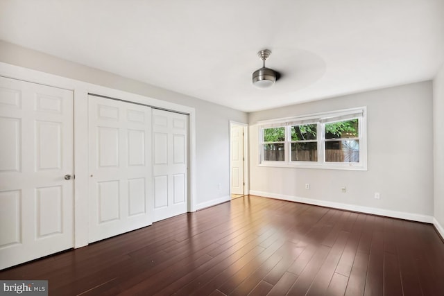 810 Sugarland Run Dr, Sterling, VA 20164 - unfurnished bedroom with baseboards, a closet, and dark wood-type flooring