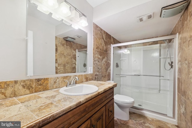810 Sugarland Run Dr, Sterling, VA 20164 - bathroom with tile walls, vanity, a shower stall, and toilet