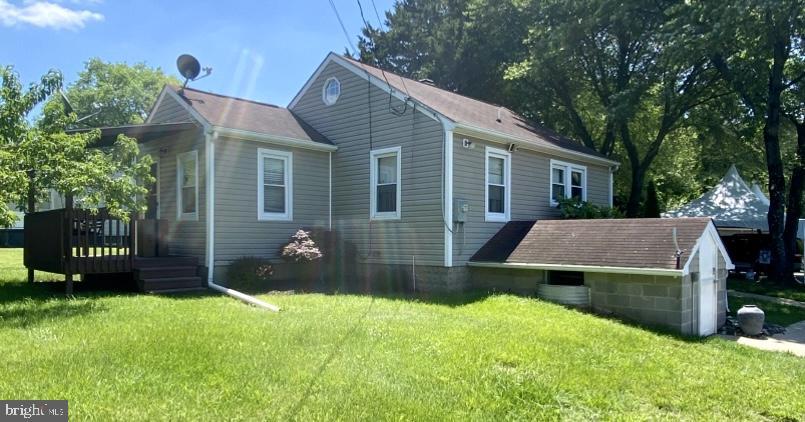 1029 Minnetonka Rd, Severn, MD 21144 - view of side of property with a lawn and a deck
