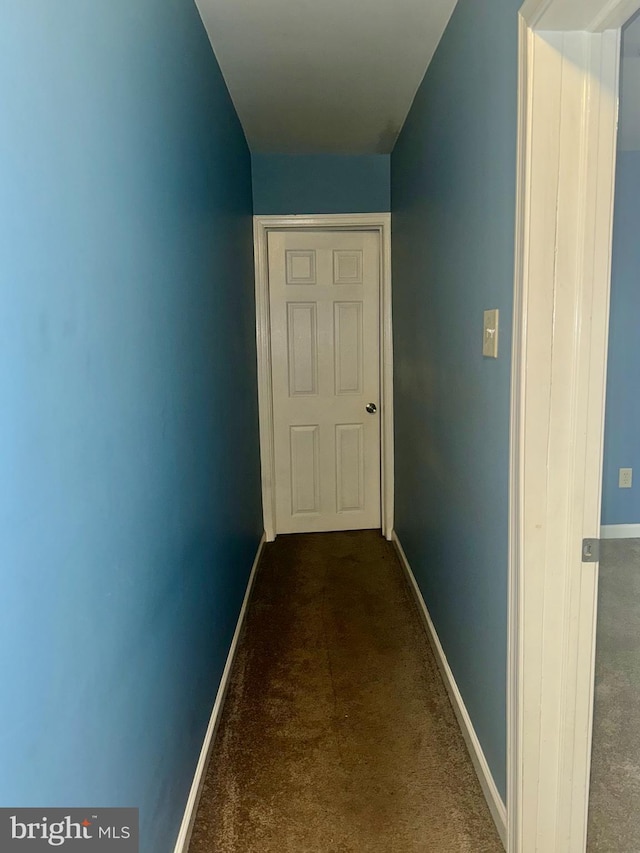 117 N Dupont St, Wilmington, DE 19805 - hallway featuring dark colored carpet and baseboards