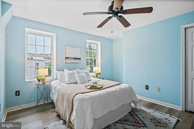 31 S Ann St, Baltimore, MD 21231 - bedroom with baseboards, wood finished floors, and a ceiling fan