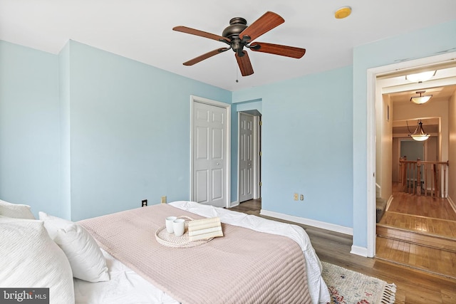 31 S Ann St, Baltimore, MD 21231 - bedroom with wood finished floors, baseboards, and ceiling fan