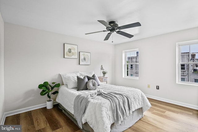 31 S Ann St, Baltimore, MD 21231 - bedroom with baseboards, wood finished floors, and a ceiling fan