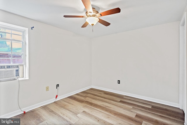 31 S Ann St, Baltimore, MD 21231 - spare room featuring wood finished floors, ceiling fan, baseboards, and cooling unit