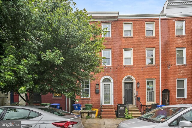 31 S Ann St, Baltimore, MD 21231 - view of property with entry steps and brick siding