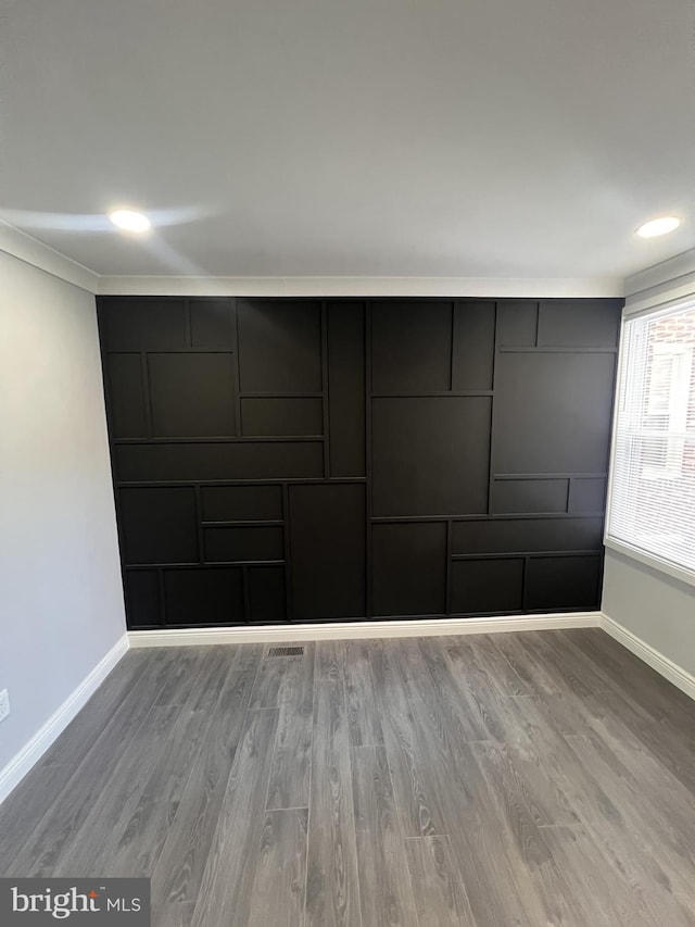 1712 W 65th Ave, Philadelphia, PA 19126 - empty room featuring baseboards, wood finished floors, and crown molding