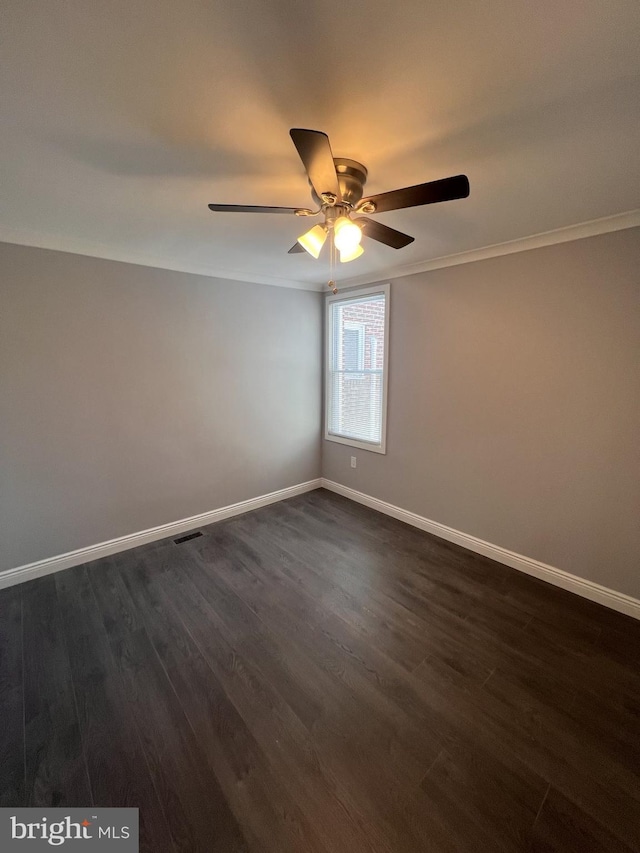 1712 W 65th Ave, Philadelphia, PA 19126 - empty room with baseboards, a ceiling fan, dark wood finished floors, and ornamental molding