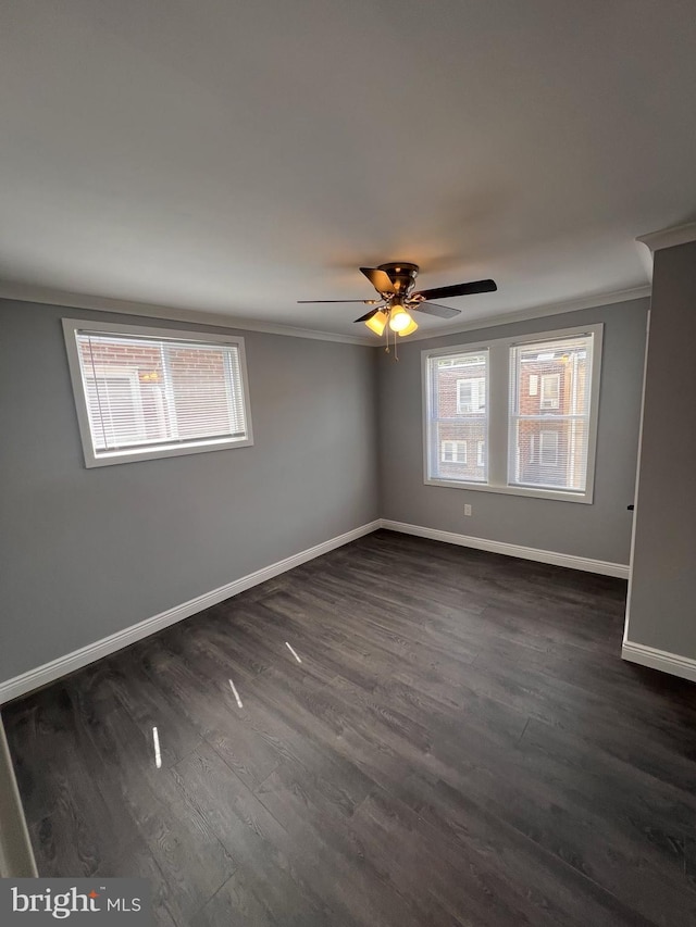 1712 W 65th Ave, Philadelphia, PA 19126 - empty room with ornamental molding, plenty of natural light, dark wood-type flooring, baseboards, and ceiling fan
