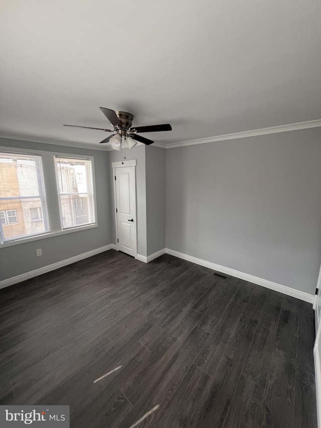 1712 W 65th Ave, Philadelphia, PA 19126 - empty room featuring dark wood-style flooring, a ceiling fan, baseboards, and ornamental molding