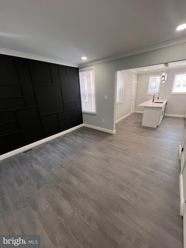 1712 W 65th Ave, Philadelphia, PA 19126 - unfurnished living room with dark wood finished floors, baseboards, a sink, and recessed lighting