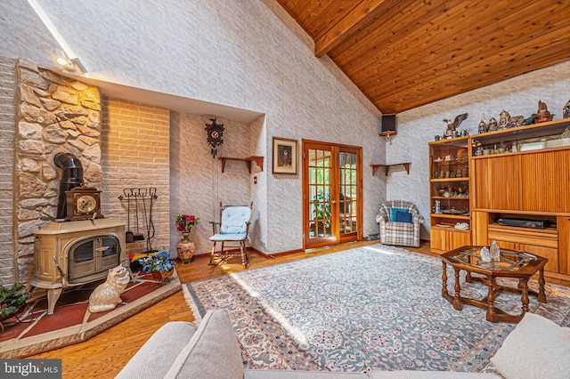 437 S 8th S, Galloway, NJ 08205 - living area with a wood stove, wood finished floors, high vaulted ceiling, and wooden ceiling with exposed beams