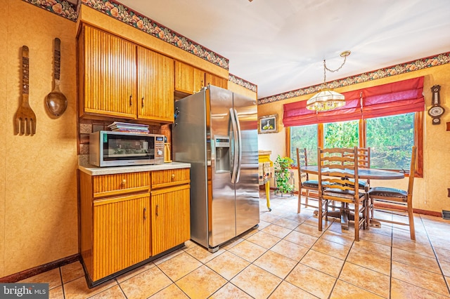437 S 8th S, Galloway, NJ 08205 - kitchen with stainless steel fridge with ice dispenser, light countertops, baseboards, light tile patterned floors, and a textured wall