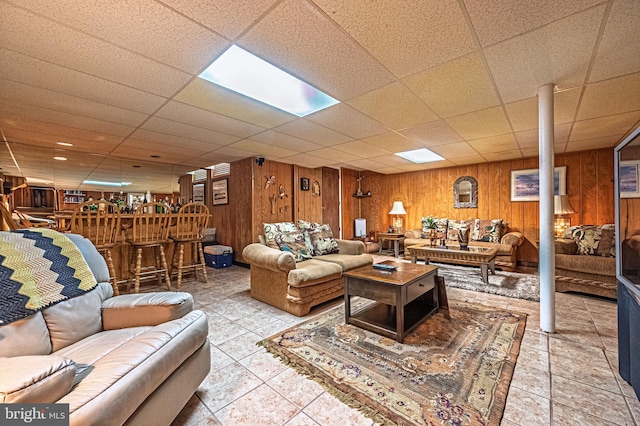 437 S 8th S, Galloway, NJ 08205 - tiled living area with a bar, wooden walls, and a paneled ceiling