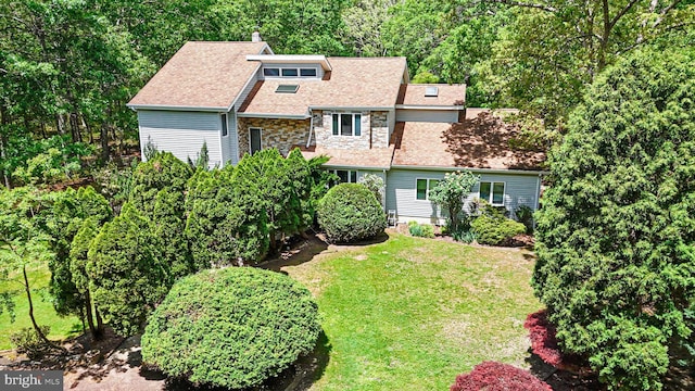 437 S 8th S, Galloway, NJ 08205 - view of front facade featuring a front yard, stone siding, a chimney, and a shingled roof