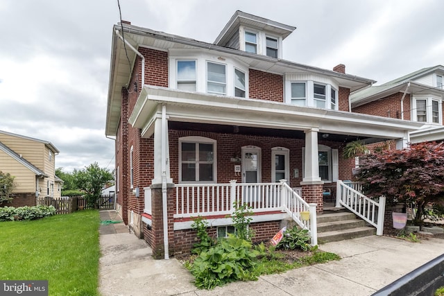 22 E 6th St, Pottstown, PA 19464 - american foursquare style home with brick siding and covered porch