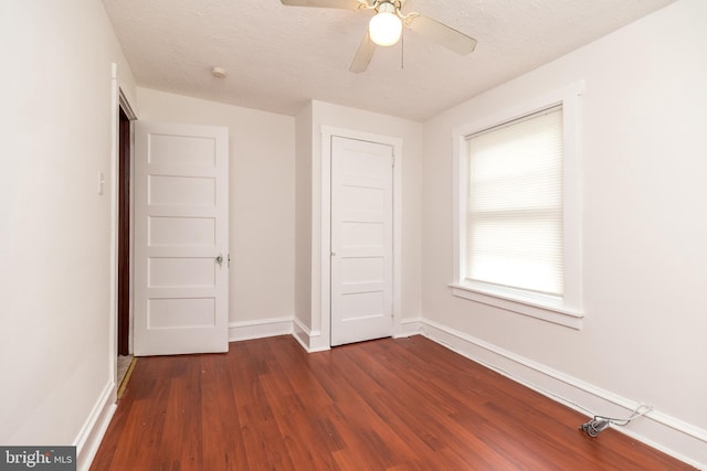 22 E 6th St, Pottstown, PA 19464 - empty room with dark wood-style flooring, baseboards, ceiling fan, and a textured ceiling