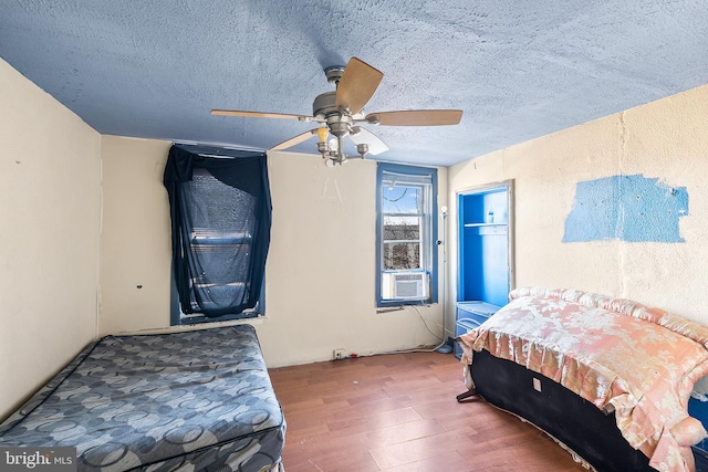 2348 N Mascher St, Philadelphia, PA 19133 - bedroom featuring wood finished floors, a textured ceiling, cooling unit, and ceiling fan