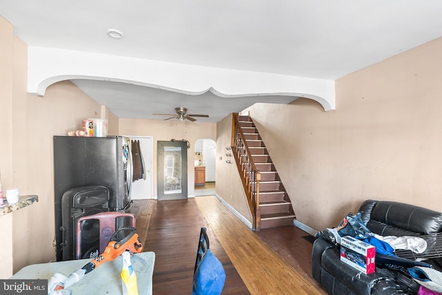 2348 N Mascher St, Philadelphia, PA 19133 - living room featuring arched walkways, wood finished floors, stairway, baseboards, and a ceiling fan