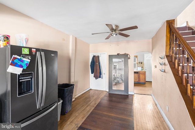2348 N Mascher St, Philadelphia, PA 19133 - kitchen featuring stainless steel fridge with ice dispenser, a ceiling fan, arched walkways, hardwood / wood-style flooring, and baseboards