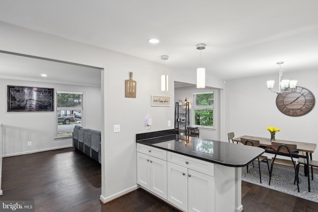 131 Oakwood Dr, Stafford, VA 22554 - kitchen with a peninsula, dark countertops, white cabinets, plenty of natural light, and recessed lighting