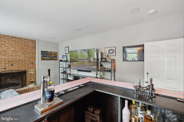 131 Oakwood Dr, Stafford, VA 22554 - bar featuring a fireplace and plenty of natural light
