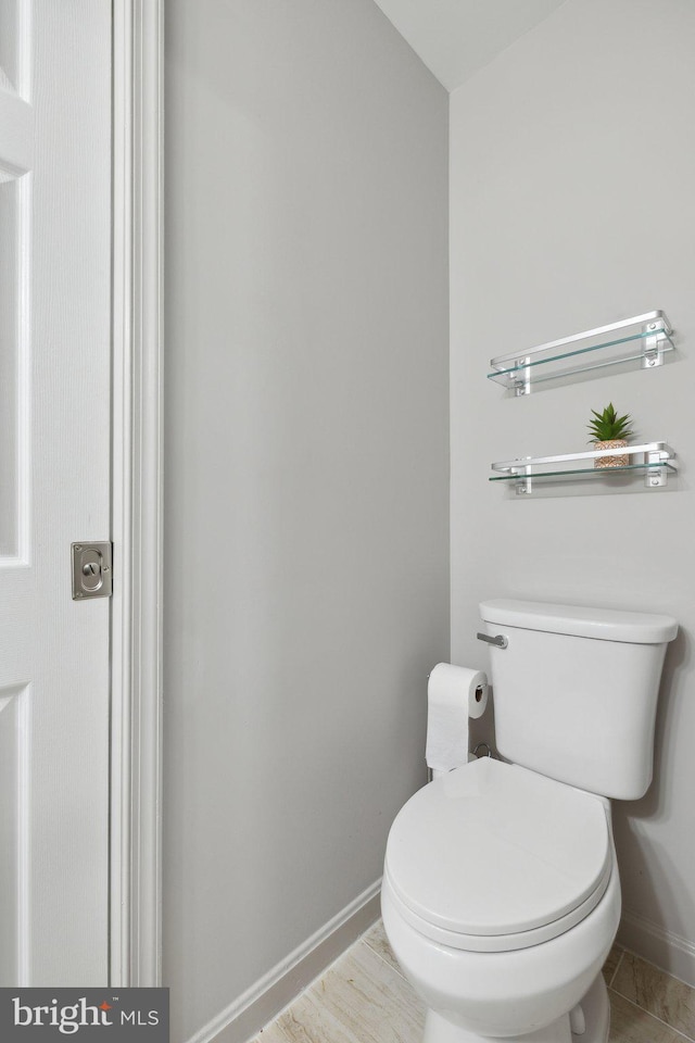 131 Oakwood Dr, Stafford, VA 22554 - bathroom featuring baseboards and toilet