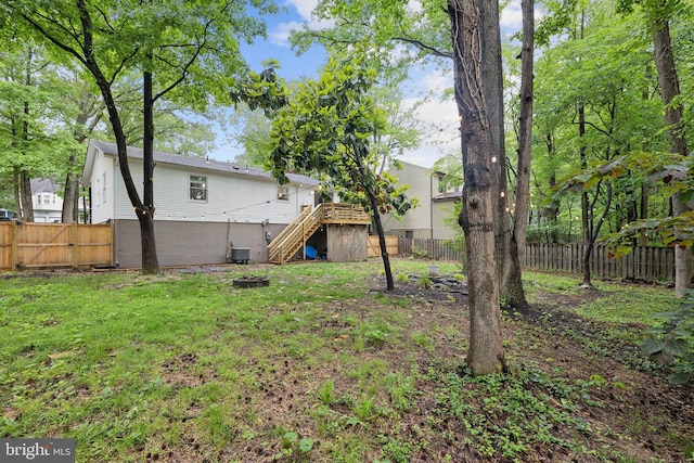 131 Oakwood Dr, Stafford, VA 22554 - view of yard featuring stairs, central AC unit, and a deck